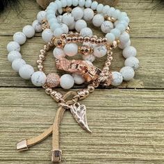 Boho Blush Bracelet Stack – where the enchanting hues of rose gold and pristine white hues come together in a whimsical dance of elegance and boho charm. This stack isn't just jewelry; it's a serenade to your free-spirited soul. Treat yourself with the Boho Blush Stack and let each bracelet tell a tale of carefree grace. So Pretty!! Wear them all on one wrist and stack 'em up or wear 3 on one wrist and two on the other with a watch! Lead & Nickel Free Bracelets are 'one size fits most' and are designed to fit wrists up to 7.5" comfortably Stretch bracelets set of 5 Off White and Rose Gold Hues Pave Crystal Embellishment Heart Charm with Leather Fringe Pull Please be aware that due to the unique and handmade nature of each product, colors, shapes, and bead sizes may vary slightly from the p Rose Gold Beaded Bracelet Jewelry, Rose Gold Bohemian Bracelets, Rose Gold Bohemian Bracelet As Gift, White Bohemian Charm Bracelet For Gift, Bohemian White Charm Bracelet For Gift, Bohemian Rose Gold Beaded Bracelets Gift, Bohemian Style White Charm Bracelet For Gift, Bohemian White Bangle Jewelry, Bohemian Rose Gold Bangle