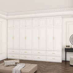 a living room with white cabinets and a ottoman on the floor in front of it