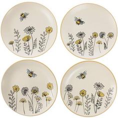 four plates with yellow flowers and bees on them