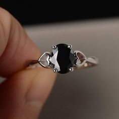 This is a gorgeous handmade creation. Its beauty is its simplicity & Elegance. The 6*8mm oval shape faceted natural black spinel is crafted in solid sterling silver and with rhodium plated. All item is sent in a beautiful gift box If you have any idea of design your ring,pls contact me directly. You can realize more lovely stuff clicking the link https://www.etsy.com/shop/knightjewelry?refshopsection_shophome_leftnav Please leave the correct address and you phone number for delivering succes Black Oval Sapphire Promise Ring, Classic Black Oval Sapphire Ring, Classic Black Sapphire Oval Ring, Classic Oval Black Spinel Jewelry, Elegant Oval Black Spinel Rings, Oval Black Rings For Promise, Black Promise Ring With Polished Finish, Black Oval Rings For Promise, Black Oval Rings For Anniversary