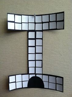 the letter e is made up of squares and rectangles in black and white