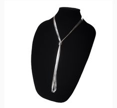 The liquid-like texture of the sterling silver cylinders  strung together by hand gives to this this lovely layering long necklace the flexibility to be worn long, wrapped or doubled up. Stylishly sleek, extra slick and easy to wear, is the versatile multi-way necklace your or her jewelry collection craves! Wear it lasso style or create custom layered looks. Check out pictures for ideas. Our Liquid Silver Necklace with 10 strands is a great gift idea for wives, moms, teachers, sisters or any oth Silver Lariat Long Necklace As Gift, Silver Lariat Necklace For Party, Silver Lariat Long Necklace For Gift, Silver Lariat Chain Necklace For Layering, Elegant Long Drop Silver Chain Necklace, Adjustable Silver Long Necklace For Formal Occasions, Silver Multi-strand Lariat Necklace Gift, Formal Silver Long Necklace, Silver Long Drop Lariat Necklace For Formal Occasions