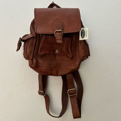 Brown Salem Mini Backpack By Overland In Cognac Leather. Nwt. Weathered Oiled Leather, Soft Slouchy Design, Zip And Snap Buckle Closure, Cotton Lining, Exterior And Interior Pockets, Adjustable Shoulder Straps. 11.70" Height, 7.50" Wide, 3" Deep, 1.75 Pounds Daily Use Leather Flap Backpack, Classic Leather Satchel Backpack For Trips, Cognac Leather Backpack For Travel, Classic Brown Flap Backpack, Cognac Soft Leather Backpack For Travel, Vintage Leather-lined Backpack, Leather Backpack With Adjustable Strap And Flap, Leather Flap Backpack With Adjustable Strap, Leather Backpack With Flap And Adjustable Strap