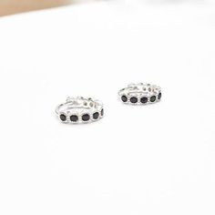 A Pair Of Sterling Silver 925 BLACK CZ Hoop EarringsEarring Inner Diameter: 9 mmEarrings are also available in 14k Gold Filled.♥♥♥♥► Nickel Free► Tarnish Resistant► No Allergic reaction► 30 days return policy► Accept replacements and custom orders♥♥♥♥► I ship all items in a jewelry gift box► Greeting card - upon request♥♥♥♥Shipping information :► Tracking number► Expedited / Express shipping - additional payment¨¨¨¨°º©©º°¨¨¨¨¨¨°º©©º°¨¨¨¨► My Shop: https://www.etsy.com/shop/JewelsByMoonli ¨¨¨¨°º© Adjustable Minimalist Cubic Zirconia Earrings, Black Hypoallergenic Huggie Earrings, Black Hoop Cartilage Earrings For Gift, Black Huggie Hoop Earrings Gift, Black Minimalist Sterling Silver Cartilage Earrings, Black Round Huggie Earrings For Everyday, Black Sterling Silver Huggie Earrings, Black Sterling Silver Round Huggie Earrings, Nickel-free Small Hoop Black Jewelry