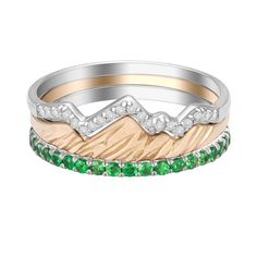 three rings with green and white stones on each one, set in two different colors