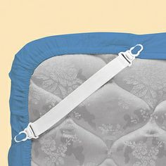 a blue and white pillow with straps on it