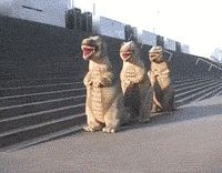 three statues of animals sitting on the side of a stadium bleachers with their mouths open