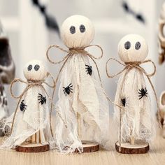 three halloween decorations made to look like ghostes