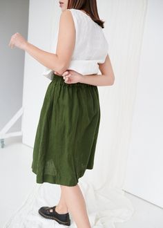 "SIZING & FIT This skirt is loose. Before placing an order, check the approximate measurements of the finished garment given below. Model is 5′6″ (170cm) tall with an 80cm/31″ bust, 68cm/26″ waist, 91cm/35″ hip, and she is wearing an XS in forest green. XS Length ± 65cm | 25.6\" Unstretched waist ± 60cm | 23.6\" Hips ± 130cm | 51.2\" Hem width ± 160cm | 63\" S-M Length ± 65cm | 25.6\" Unstretched waist ± 68cm | 26.8\" Hips ± 138cm | 54.3\" Hem width ± 168cm | 66.1\" L-XL Length ± 65cm | 25.6 Linen Green Lined Skirt Bottoms, Green Linen Lined Skirt Bottoms, Green Linen Relaxed Fit Skirt, Knee-length Linen Gathered Skirt, Green Linen Skirt For Summer, Summer Linen Green Skirt, Summer Green Linen Skirt, Casual Green Linen Skirt, Green Linen Lined Skirt