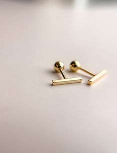 "✿ Tiny Modern Bar Gold Stud Earrings ✿ Made of 18k gold filled metal with screw on backs making them incredibly comfortable to wear.  The bar itself is 3/8\" in length.  Hypoallergenic, lead free, nickel free. Great for people with sensitive ears! Polishing cloth included with your order. Handmade in my home studio in Brookings, SD." Bar Studs, Modern Bar, Jewelry Studio, Gold Filled Earrings, Bar Earrings, Gold Stud, Screw Back Earrings, Sensitive Ears, Etsy Fashion