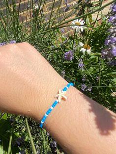 Handmade by me,  white and blue beach bracelet, delicate and beautiful 💙🤍. can be sold as is or customised, by colours, beads, charms or letters, message me if required! :) Blue Bracelets With Starfish Charm Ocean-inspired, Blue Beaded Bracelet With Starfish Charm, Blue Starfish-shaped Beaded Bracelets As Gift, Handmade Blue Summer Jewelry, Handmade Summer Blue Jewelry, Ocean-inspired Blue Starfish Bracelets, Blue Beaded Bracelets With Starfish Charm, Blue Beaded Bracelets With Starfish Charm As Gift, Blue Beaded Bracelet With Starfish Charm As Gift