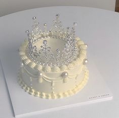 a white cake with a tiara on top