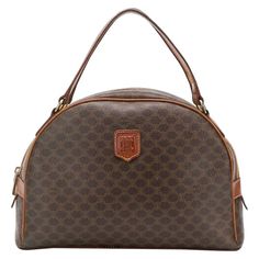 Celine brown leather and canvas monogram hand bag featuring two leather top handles, gold-tone hardware, brown leather details, a top zip fastening, an all-over print and a front logo plaque. 11.8in. (30cm) X 7.8in. (20cm) X 3.9in (10cm) In good vintage condition. Made in France. We guarantee you will receive this iconic item as described and showed on photos. Width: 11.8in. (30cm) Height:17.8in. (20cm) Width:3.9in (10cm) Celine Micro Luggage, Celine Mini Luggage, Pastel Leather, Trapeze Bag, Vintage Celine, Logo Hand, Browning Logo, Leather And Canvas, Orange Bag