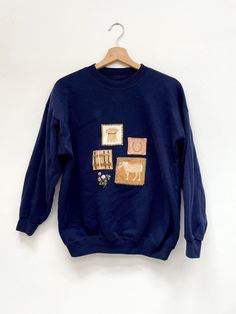 "42\" Vintage rad 80s 90s Jumper Sweatshirt  ♥ Chest measurement armpit to armpit with top laid flat on the table is 21\" - so 42\"\" all round     Front collar to front hem is 22\"     Comes in to a 30\" waist Really nice horse, horseshoe & farm corn patches on the front :) ♥ Jumper is tissue wrapped and sealed with a pretty The Lucky Fox sticker, ready to gift  a truly original gift, or just gift it to yourself! for new additions to my store please become a fan https://www.facebook.com/theluckyfoxetsy Please check out my other store for all my original oil paintings, dolls, pin-ups, blythes, lowbrow, limited edition prints, stickers, patchwork, sewing, pillows & so much more  https://www.emmamount.etsy.com" Vintage Navy Top For Fall, Navy Retro Top For Fall, 90s Jumper, Original Gift, Vintage Sweatshirt, Grocery Bag, Really Cool Stuff, Pin Up, Jumper