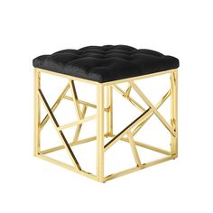 a black and gold stool with a square cushion on the top, in front of a white background