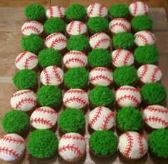 cupcakes with green and white frosting are arranged in the shape of baseballs