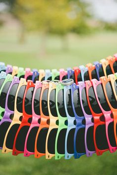 colorful sunglasses hanging on a clothes line with text overlay that reads keep your guests cool