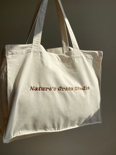 Organic Shopping tote bag Made from 100%organic cotton Luxury feel with a embroidered logo Ethically made with a transparent supply chain. For more info message me Embroidered by me :)   Washing Instructions: Washing: 30o. Bleaching no. Ironing 110o. Beige Bags With Embroidered Logo For Daily Use, Beige Rectangular Canvas Bag With Embroidered Logo, Rectangular Beige Canvas Bag With Embroidered Logo, Beige Canvas Tote Bag With Embroidered Logo, Beige Embroidered Logo Canvas Tote Bag, Everyday Beige Canvas Bag With Embroidered Logo, Everyday Canvas Shoulder Bag With Embroidered Logo, Everyday Tote Shoulder Bag With Embroidered Logo, Beige Canvas Bag With Embroidered Logo