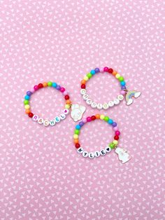 Adorable kids beaded bracelet with 6mm bright rainbow beads with your choice of name/lettering and charm. So cute and the charm adds such a unique look to your little one's bracelet! You can also choose not add a charm and just a name/word. Makes a great gift as well- everyone loves something personalized! Please provide the following information in the personalization field: -Name/word you would like -Heart color (if any)- red, orange, yellow, green, blue, purple, pink, black or gold -SIZING ** Playful Rainbow Jewelry With Letter Beads, Multicolor Name Bracelet With Letter Beads And Round Beads, Multicolor Name Bracelet With Letter Beads, Multicolor Name Bracelet With Round Letter Beads, Cute Beaded Bracelets For Personalized Gifts, Personalized Rainbow Beaded Bracelets, Personalized Rainbow Beaded Bracelets For Birthday, Personalized Rainbow Beaded Bracelets Cute Style, Personalized Rainbow Beaded Bracelet For Birthday