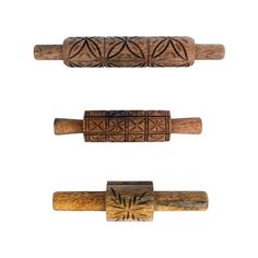 three different types of wooden canes are shown in this image, each with an intricate design on the top and bottom