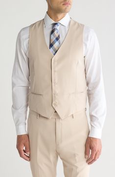 Stretch construction and a skinny cut mean modern appeal from a head-turning three-piece suit. Jacket has notched lapels; chest welt pocket; front welt pockets Vest has front button closure; V-neck Pants have zip fly with button closure; front slant pockets; back button-welt pockets Jacket and vest are lined; trousers are lined to the knee 62% polyester, 35% viscose, 3% spandex Dry clean Imported Each suit has a 6” drop, meaning that a size 38R jacket is paired with size 32 pants Turning Three, Pocket Vest, Three Piece Suit, Pocket Jacket, Three Piece, Light Beige, Welt Pockets, Welt Pocket, The Knee