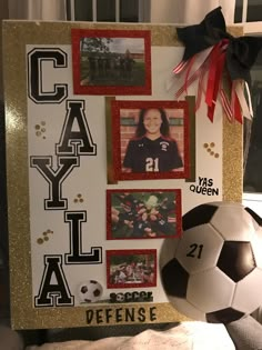 a soccer ball sitting on top of a table next to a sign that says cay al