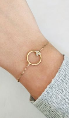 14K Gold Circle Diamond Bracelet, Delicate minimalist Diamond Bracelet, 9K Geometric solid gold bracelet, Dainty Stacking gold bracelet, 18K Gold Circle Bracelet, Gift for mom, Gift for her, Graduation Gift, FREE EXPRESS SHIPPING Delicate, minimalist circle charm bracelet with 3 white diamonds made in 18K, 14K or 9K solid gold. A gorgeous bracelet that you will absolutely love! ------------------------------------------- D E T A I L S 18K, 14K or 9K Solid Gold Circle diameter: 15mm Total of ston Modern Round Diamond Bracelet Tarnish Resistant, Modern Tarnish-resistant Round Diamond Bracelet, Minimalist 14k Gold Bracelet With Diamond Accents, Delicate Round Bracelets With Single Cut Diamonds, Gold Plated Diamond Bracelet With Accents, Modern 14k Gold Diamond Bracelet With Single Diamond, Minimalist Gold Bracelets With Diamond Accents, Modern Yellow Gold Round Diamond Bracelet, 14k Gold Bracelet With Single Diamond