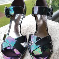 Gorgeous Iridescent Oil Slick High Heel Sandals, By Gianni Bini. Dillards Design, In Iridescent Black, "Petrol" Color, Showing Greens, Blues And Purples. Iridescent Colors Have Variegated Pattern That Blends Togeher To Look Like An Oil Slick. Cross Strap Vamp Design, Open Toe And Elasticized Side Buckle Closure. Heel Is A Dark Mirrored Silver Or Pewter Color, About 3.5 Inches High. Never Worn. Iridescent Heels For Formal Summer Events, Summer Formal Iridescent Heels, Iridescent Sandals For Summer Parties, Iridescent Open Toe Heels For Party, Iridescent Heels For Summer Evenings, Summer Party Iridescent Sandals, Iridescent Open Toe Sandals For Party, Iridescent Open Toe Heels For Spring, Iridescent Heels For Formal Occasions