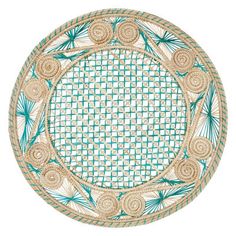 a green and white plate with some designs on it