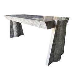 an artistically designed console table made out of concrete