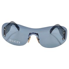 Get your hands on these incredible Gucci dead stock sunglasses circa 1990s! The perfect Y2K shield style sunglasses featuring cool blue lenses alongside blue detailing. These are such a classic and fun statement pair of sunglasses! Match these to your favorite Gucci handbag and pair with some Miu Miu mules for a chic vintage look. Never been worn, new dead stock sunglasses in perfect condition, please see photos. Made in Italy. Vintage Gucci Sunglasses With Tinted Lenses, Gucci Blue Sunglasses With Gradient Lenses, Vintage Gucci Tinted Sunglasses, Blue Gucci Sunglasses With Gradient Lenses, Trendy Blue Gucci Sunglasses, Vintage Gucci Sunglasses With Gradient Lenses, Vintage Blue Sunglasses With Uva Protection, Gucci Casual Shield Sunglasses With Uv Protection, Casual Gucci Shield Sunglasses With Tinted Lenses