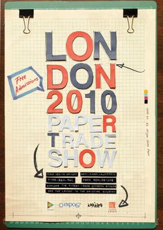 an advertisement for the london paper trade show on a piece of paper with scissors hanging from it