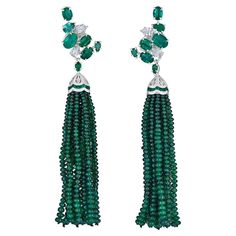 A pair of Emerald and Diamond Cluster Earrings with Detachable Tassels made of natural Emerald Beads. Hand crafted from 18k white gold, these earrings feature 10.45 carats of natural faceted green emeralds, 0.95 carats of white diamonds and approximately 76 carats of green emerald beads. The Tassel can be removed from the main earring and worn as a cluster climber. The cluster portion is 0.95 inches in length and the entire earring with tassel is 3.6 inches long. This versatile pair of earrings Wedding Jewelry Photography, Jewelry Making Patterns, Pearl Chandelier Earrings, Diamond Chandelier Earrings, Gold Chandelier Earrings, Pretty Jewelry Necklaces, Diamond Cluster Earrings, Antique Jewelry Necklace, Emerald Bead