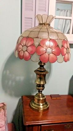 a lamp sitting on top of a wooden table