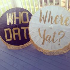 two umbrellas that say, who dat? and where yat?