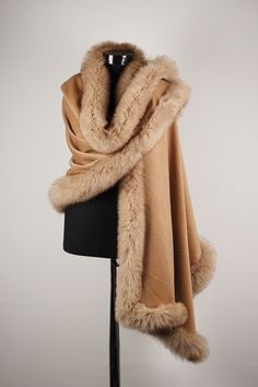 Wrap yourself in luxury this winter with one of our many fur trim wraps and shawls. Designed to keep you warm & feeling cozy! This soft cashmere shawl has fox fur trim all around the entire accessory for a glam appeal. The Fur trim is hand-stitched all around cashmere shawl. Fashionable really elegant, it is luxurious soft incredibly warm wrap. * Length: 190 Cm / 74 inch * Width: 75 Cm / 29 inch * Genuine Thick and full Fox Fur Trim. * Materials: Cashmere Shawl - Fox Fur * Fur is long, lush Shawl Outfit Winter, Wraps And Shawls, Shawl Outfit, Cute Online Clothing Stores, Wedding Shawls, Winter Wrap, Winter Shawl, Fur Clothing, Fur Shawl