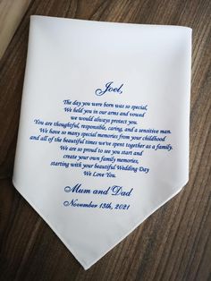 a wedding handkerchief with a poem written on the front and back, in blue ink