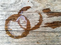 an apple painted on the side of a wooden wall