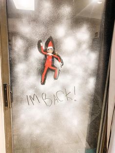 an image of a cat in the hat coming out of a door that says i'm back