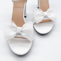 "Triple layered organza shoe clips can be worn on the front, back or side of most shoes. Listing is for one pair. Shoes not included. *Bows need to be fluffed upon arrival. - 1 pair - 3/12\" wide - Made in the USA. SHOP MORE SHOE CLIPS, https://www.etsy.com/shop/melissavelia?section_id=24145024 *Although clips are gentle and cushioned, each shoe fabric is different. Please test out the clips on your shoes before leaving them on for a long period of time. We are not responsible for any indentatio Summer White Heels With Satin Bow, White Wedding Shoes With Satin Bow And Round Toe, White Wedding Shoes With Satin Bow And Block Heel, Elegant White Sandals With Satin Bow, White High Heel Sandals With Satin Bow, White Party Heels With Bow, White Heels With Bow For Party, White High Heels With Satin Bow, White High Heel Heels With Satin Bow