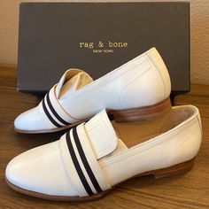 New In Box! $395 Rag & Bone New York Amber Loafer Ivory White Leather Oxfords Flats Shoes Color: Ivory/White/Cream Leather With Black And Ivory Ribbon Strap Across Vamp Size: 10/40 -Gorgeous Classic Style -Soft Ivory/White Leather -Stretch Panel At Top Vamp For Comfort -Leather Soles -.75” Stacked Heel New & Never Worn. Small Mark On Inner Strap Of Left Shoe, I Haven’t Tried To Remove It. See Last Photos. Box Shows Minor Wear From Storage But Does Not Affect Shoes. Other Great Items Available! B Formal Cream Slip-on Flats, Classic White Flats With Removable Insole, White Flats With Leather Sole For Work, White Leather Sole Flats For Workwear, White Formal Flats With Removable Insole, Formal White Flats With Removable Insole, Chic Cream Loafers For Workwear, Classic White Flats For Office, Elegant White Business Flats