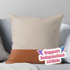 a pillow with the words support independent artists on it