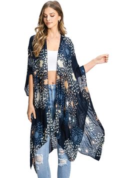 Beautiful kimono cardigan with an open-front and 3/4 length sleeves. Soft woven fabric with an abstract pattern. Perfect for light layering over casual outfits! CARE | Hand Wash Cold CONTENTS | 100% Viscose MEASUREMENTS | 40"/102 cm Top to Bottom (Size O/S) MODEL | 5'8 - wearing O/S IMPORTED Casual Fall Cover-up With Kimono Sleeves, Fall Rayon Kimono With Kimono Sleeves, Summer Beach Outerwear With 3/4 Sleeve, Spring Beach Outerwear With 3/4 Sleeves, Beach Outerwear For Spring With 3/4 Sleeves, Fall Vacation Printed Cardigan, Beach Printed Open Front Cardigan, Summer Kimono For Layering, Summer Long Sleeve Kimono For Layering