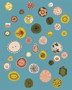 an image of many different colored objects in the shape of circles and flowers on a blue background