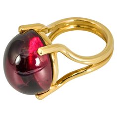 "Costis" Stone on Wire Ring with an Oval Cabochon 37.74 carats Pink Tourmaline, on 18K Yellow Gold. A really special gemstone, which makes this ring one-of-a-kind. Our most minimal and elegant way to emphasize a gem's beauty mounted on wire. A perfect example of "the simplest designs, are the hardest to achieve". An important characteristic of Costis Jewelry: the amazing gemstones! Diamonds may be the protagonists in the jewelry industry, but nothing can surpass the intrigue, variety and endless combination possibilities that the colored stones offer. This is the reason that Costis’ collections are full of color and of so many interesting and different combinations. The splendor of stones and cuts define Costis' jewelry, exploring diamonds, pearls, rubies, sapphires, emeralds, but also his Wire Ring, Colored Stones, Wax Casting, Wire Rings, Lost Wax Casting, Ring Oval, Lost Wax, Oval Cabochon, Pink Tourmaline