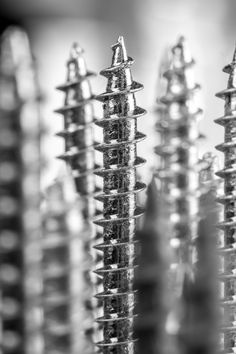 black and white photograph of screws in the process of retourting them into color