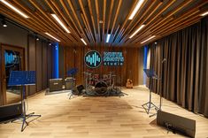 a recording studio with sound equipment and lighting