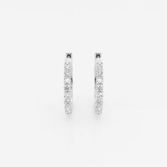 Who doesn't like a pair of classic hoop earrings? This extremely versatile pair can be worn with jeans and a tee, a cocktail dress or at your summer soiree. The high quality lab-grown diamonds shimmer as you move. Classic White Hoop Earrings With Halo Design, Classic White Huggie Earrings, Classic Hoop Diamond Earrings For Everyday, Classic White Huggie Earrings For Everyday, Classic Small Hoop Earrings With Channel Set, Classic Small Hoop Diamond Earrings For Everyday Luxury, Classic White Hoop Earrings For Anniversary, Pearl And Diamond Earrings, Summer Soiree