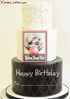 a black and white birthday cake with an image of marilyn monroe on the top layer