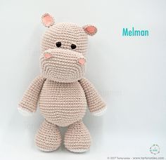 a small crocheted stuffed animal sitting on top of a white surface with the word melman written below it